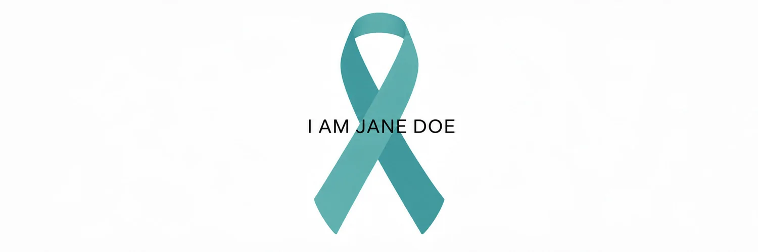 A teal ribbon on a white background bearing the words I AM JANE DOE in black.